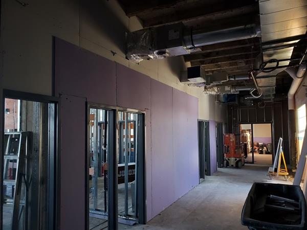 Interior partitions and drywall being installed on fourth floor classrooms